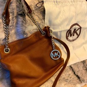 Michael Kors cross body / shoulder purse. Light brown in color